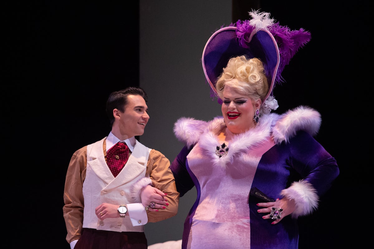 Minerva Jayne escorted into a party onstage