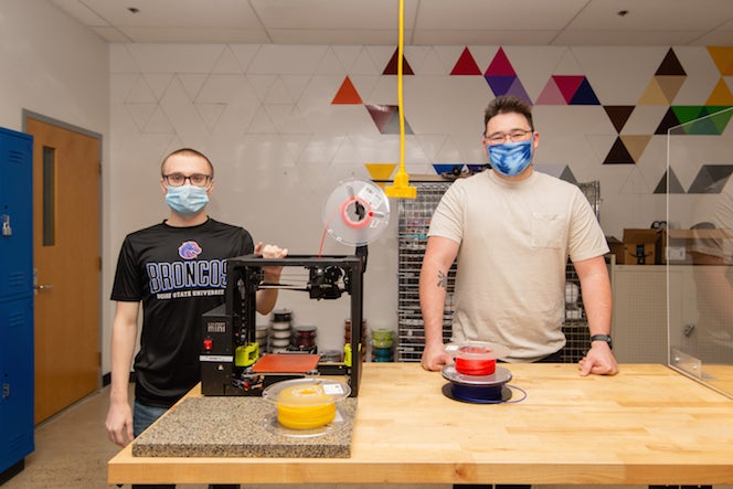 Mason and Kai work in the MakerLab