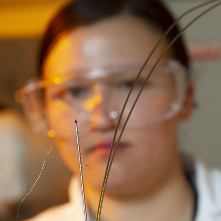 close up of student holding sensor for nuclear reactor