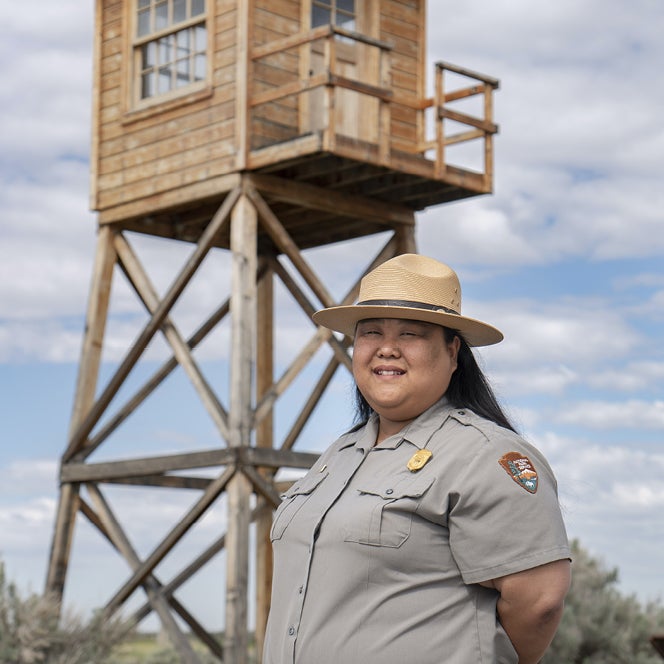 Hanako standing in front of guard tower