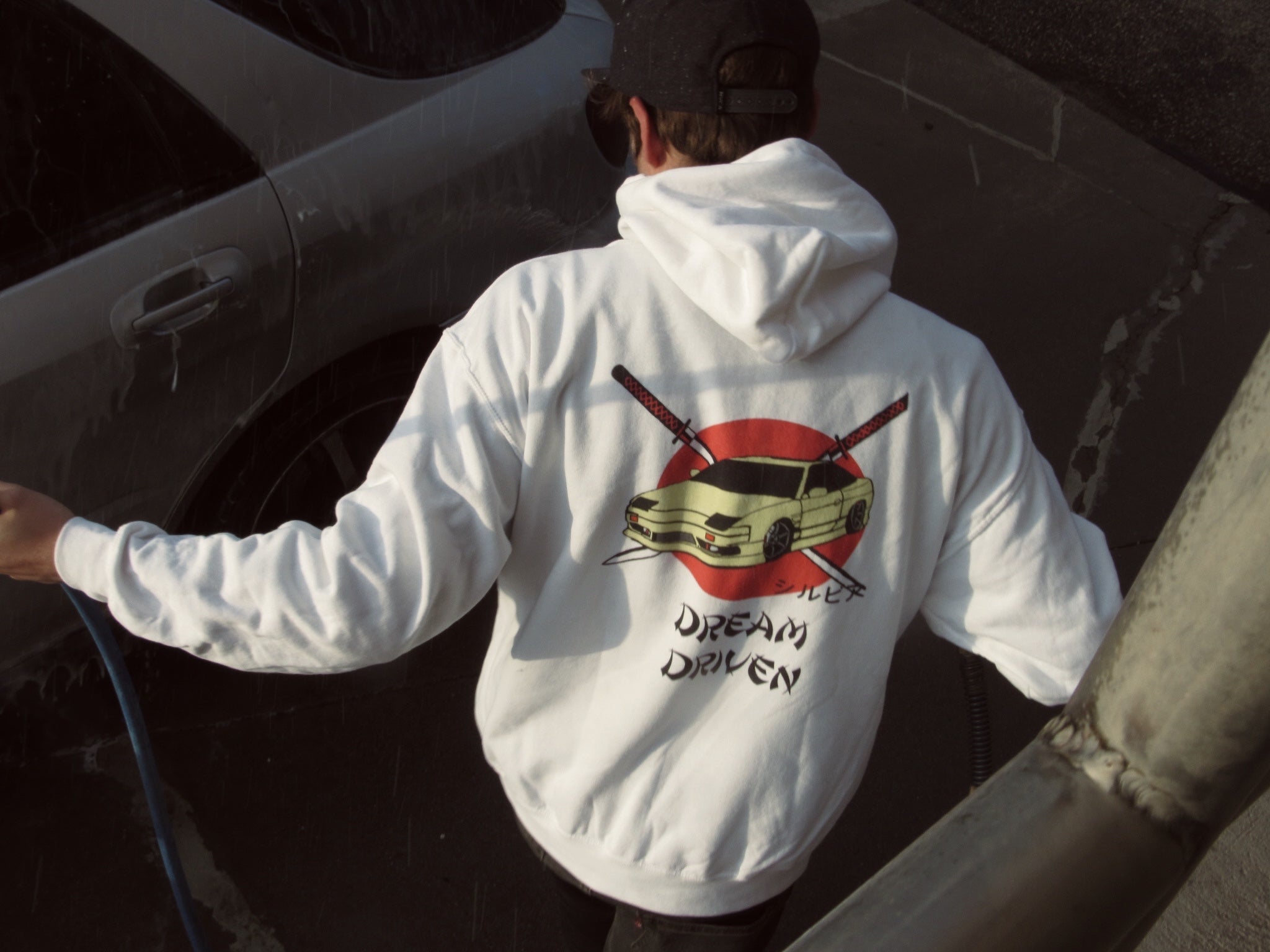 Alex Safiran wearing a dream driven sweatshirt. 