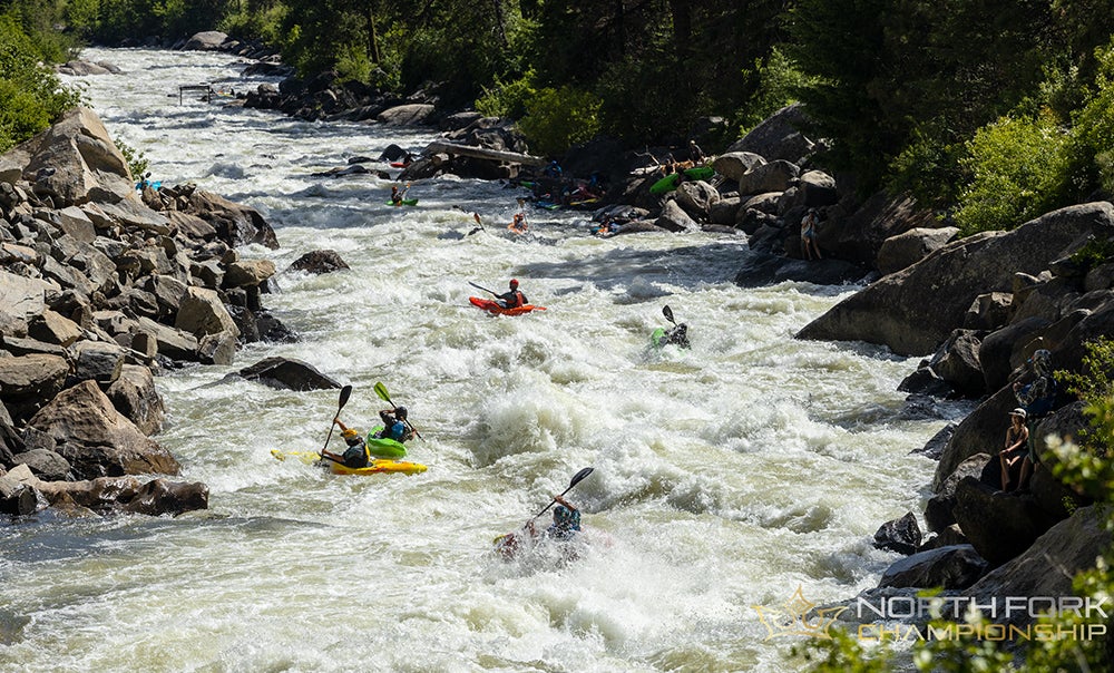  Kayakers paddle in white water kayaking championship