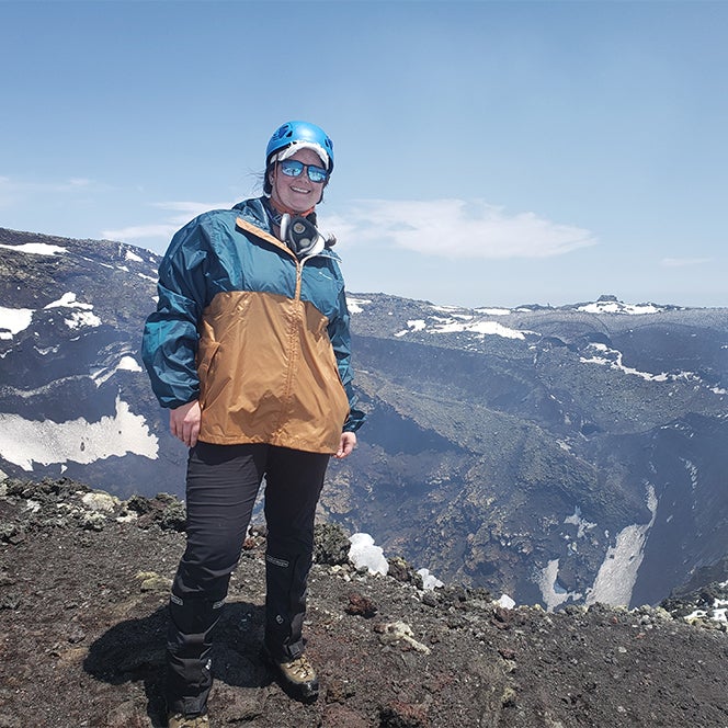 researcher standing on a volcano