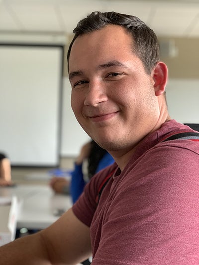 man smiles at camera