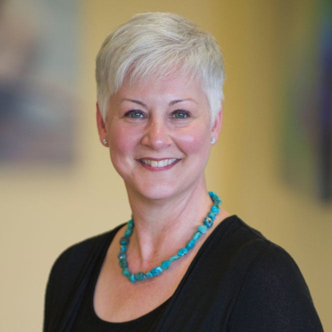 Headshot of Dr. Teresa Serratt smiling.