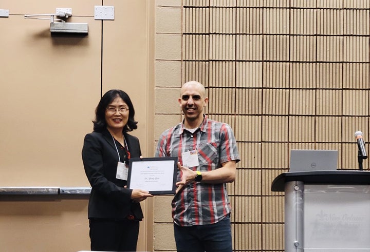 Yong Gao Receiving Reviewer of the Year Award