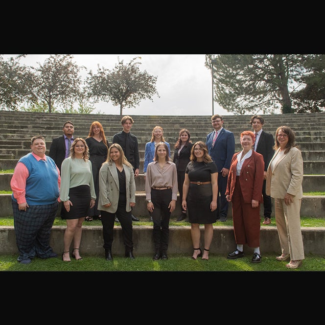 The 2022-2023 Talkin' Broncos Speech and Debate Team from Boise State standing in the amphitheater.