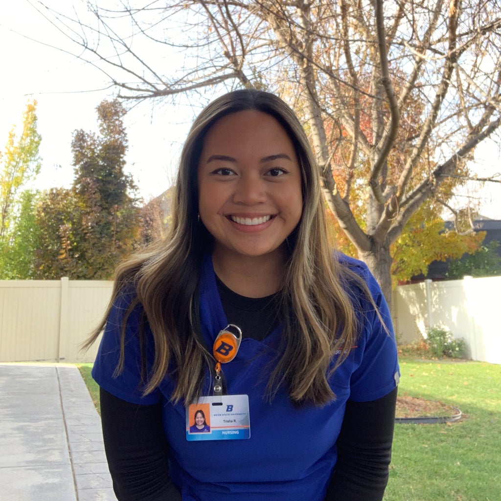 Trisha Ruayana wears her Boise State scrubs and smiles.