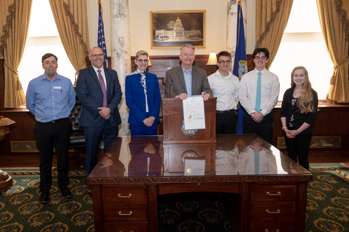 Persons pose in Idaho Governor's Office