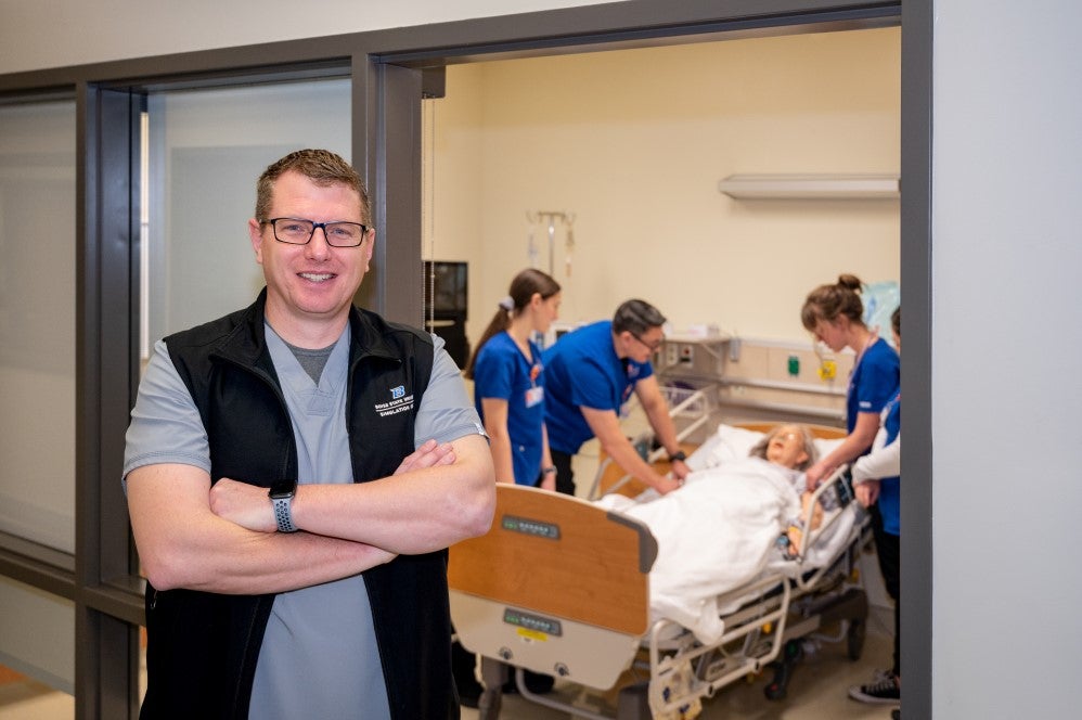 Jason Blomquist with students in nursing simulation lab