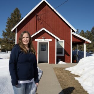 Stephanie Lewis in front of Prairie School