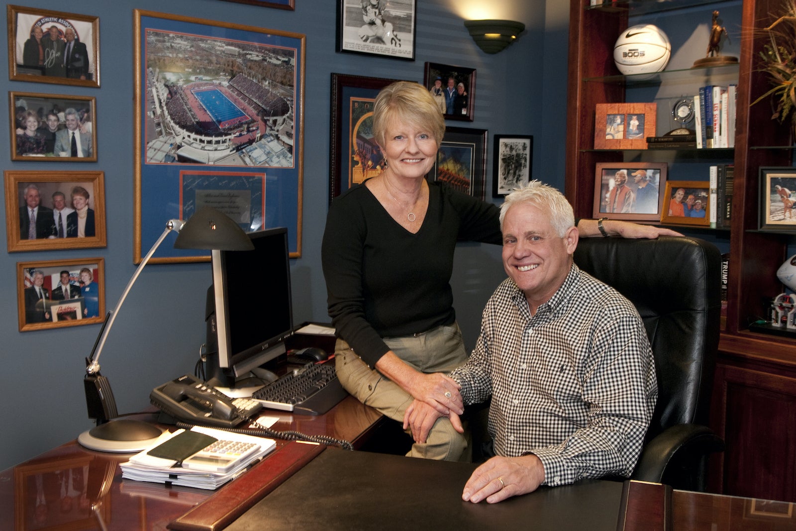 a man and a woman sit together in an office