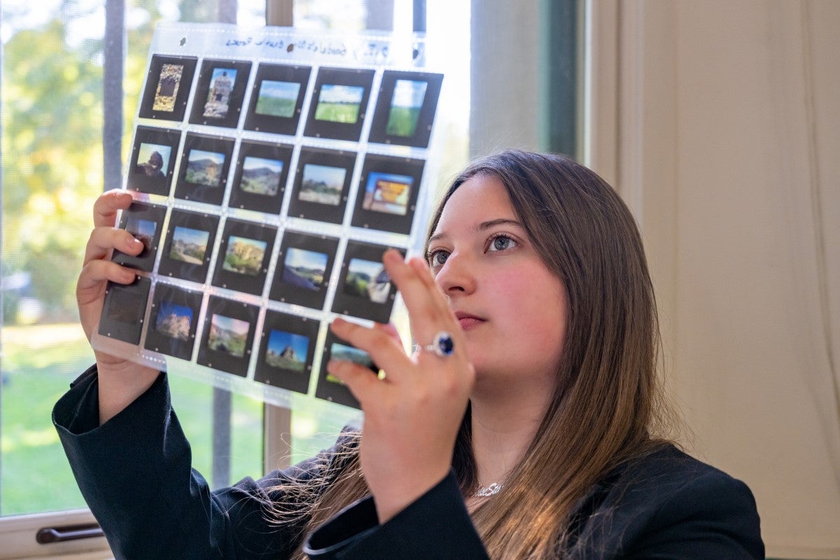 Brooklyn Allen looking at photo slides