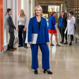 Master of Population and Health Systems Management student Molly Zimmer poses with colleagues from across the healthcare system