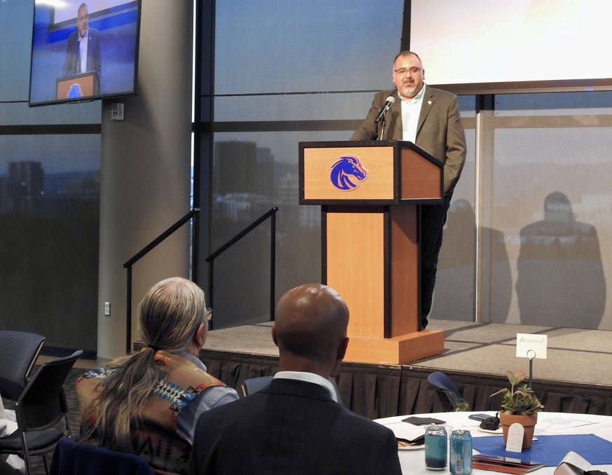 Dave Estrada at a podium speaking at the October 30 event.