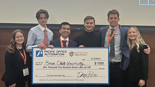 participants holding $1,500 big check 