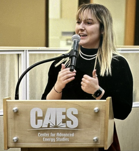 woman speaks at podium