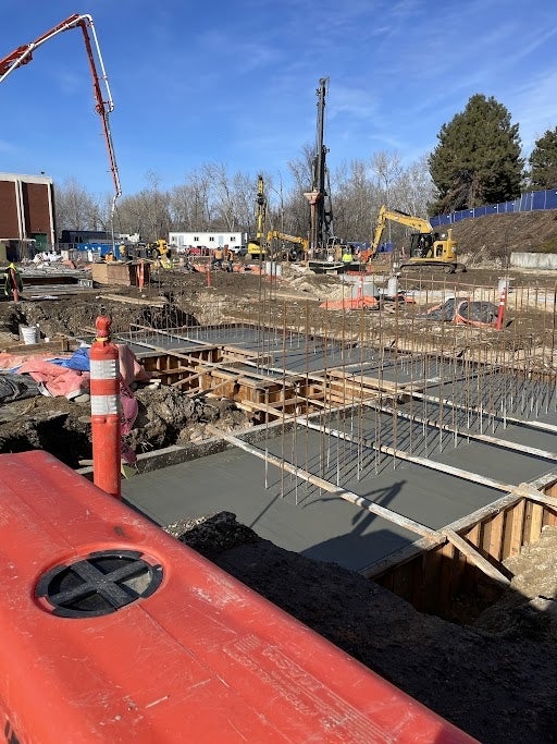 A construction site with freshly poured concrete