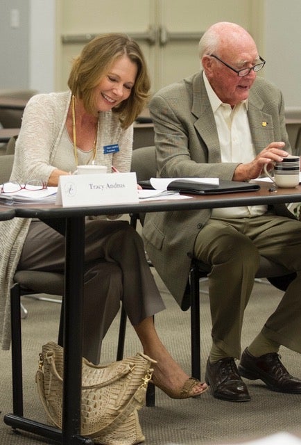 a photo of two persons seated at a table