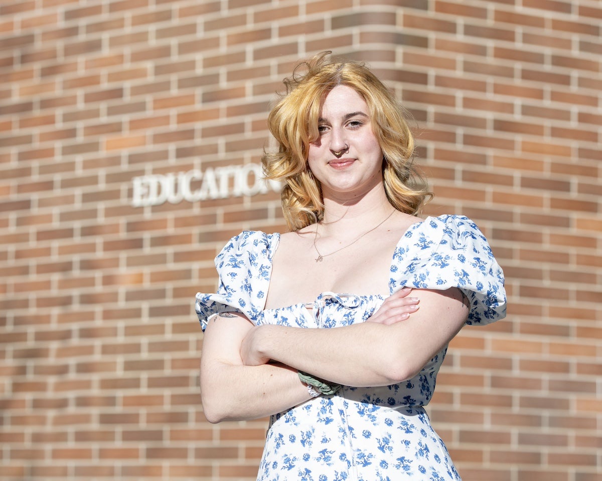 A portrait of a person in front of the Education Building on Boise State's campus