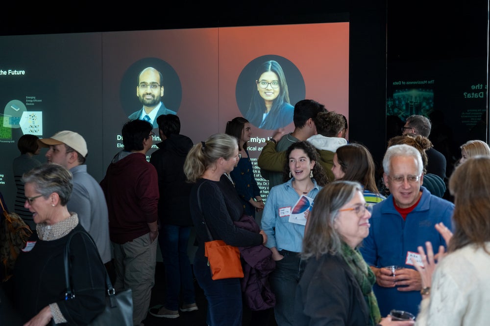 Persons gathered in a gallery for an event