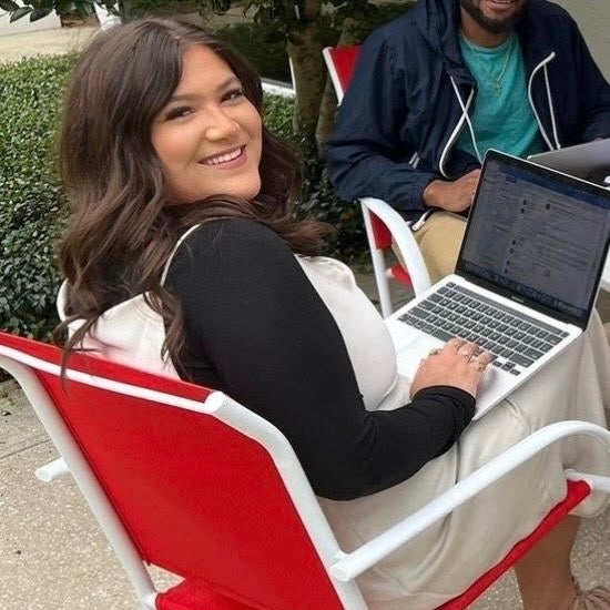 Photo of Miya Bates sitting outdoors