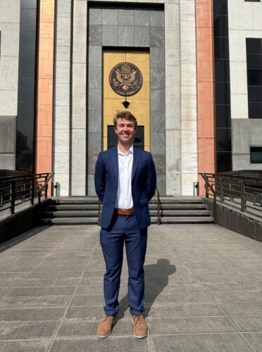 CTMBA student Josh LaPine stands in front of the U.S. embassy building in Peru.