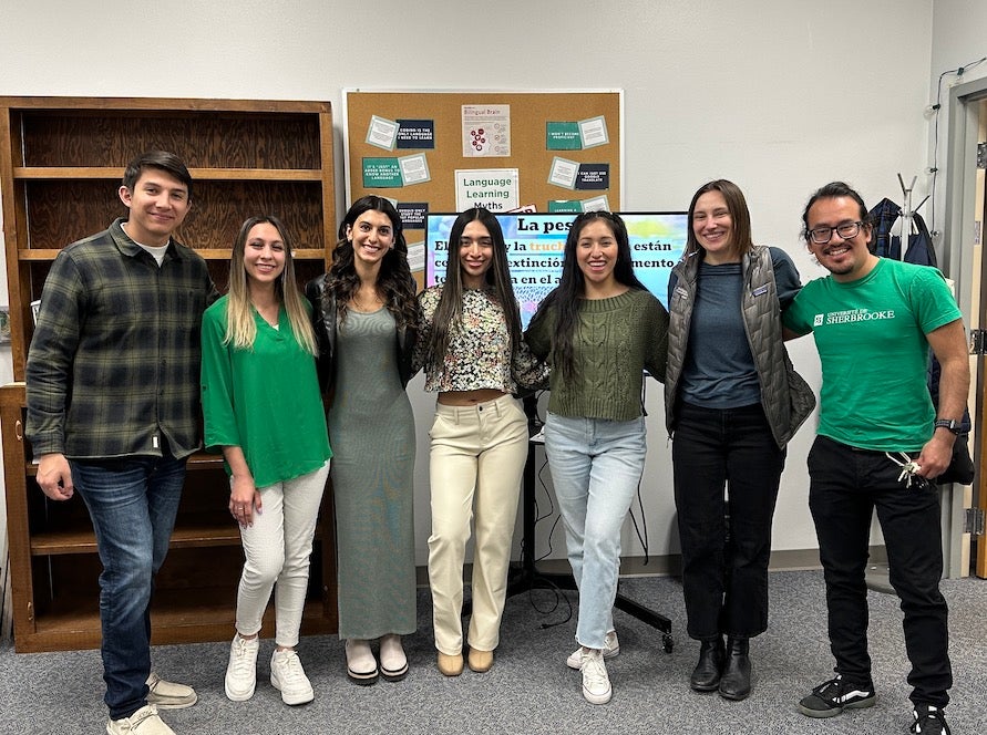 seven students link arms in group photo