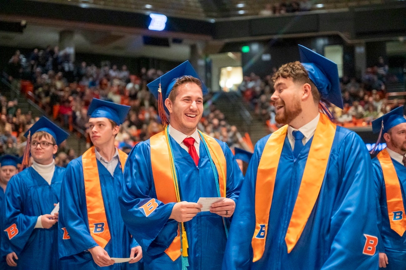 Students wait in line to receive diplomas