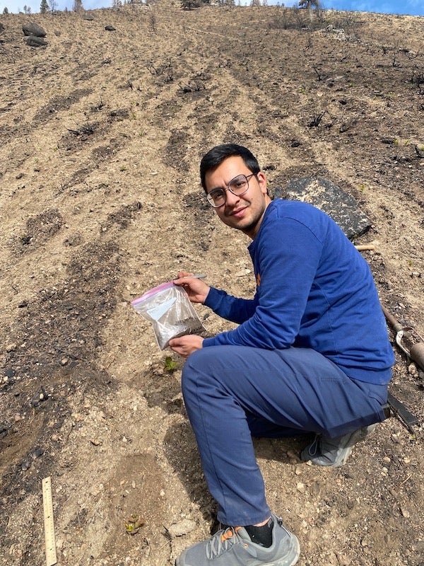 A person holds soil samples 