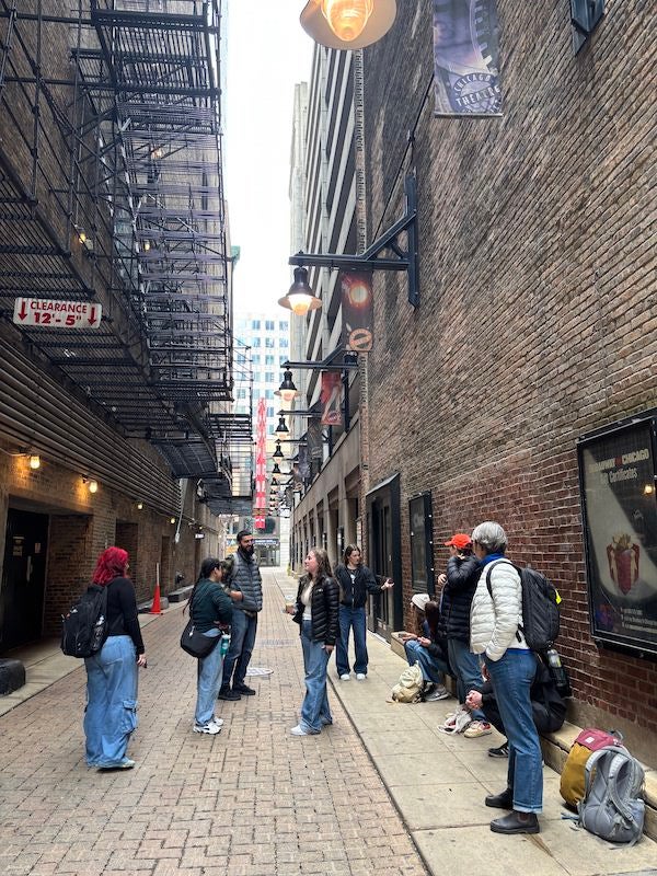 Students discuss the design of an alleyway