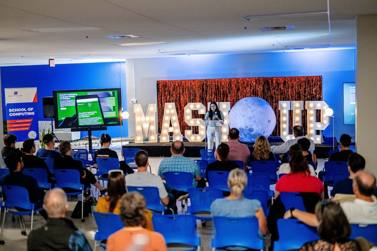 A person presents to a crowd