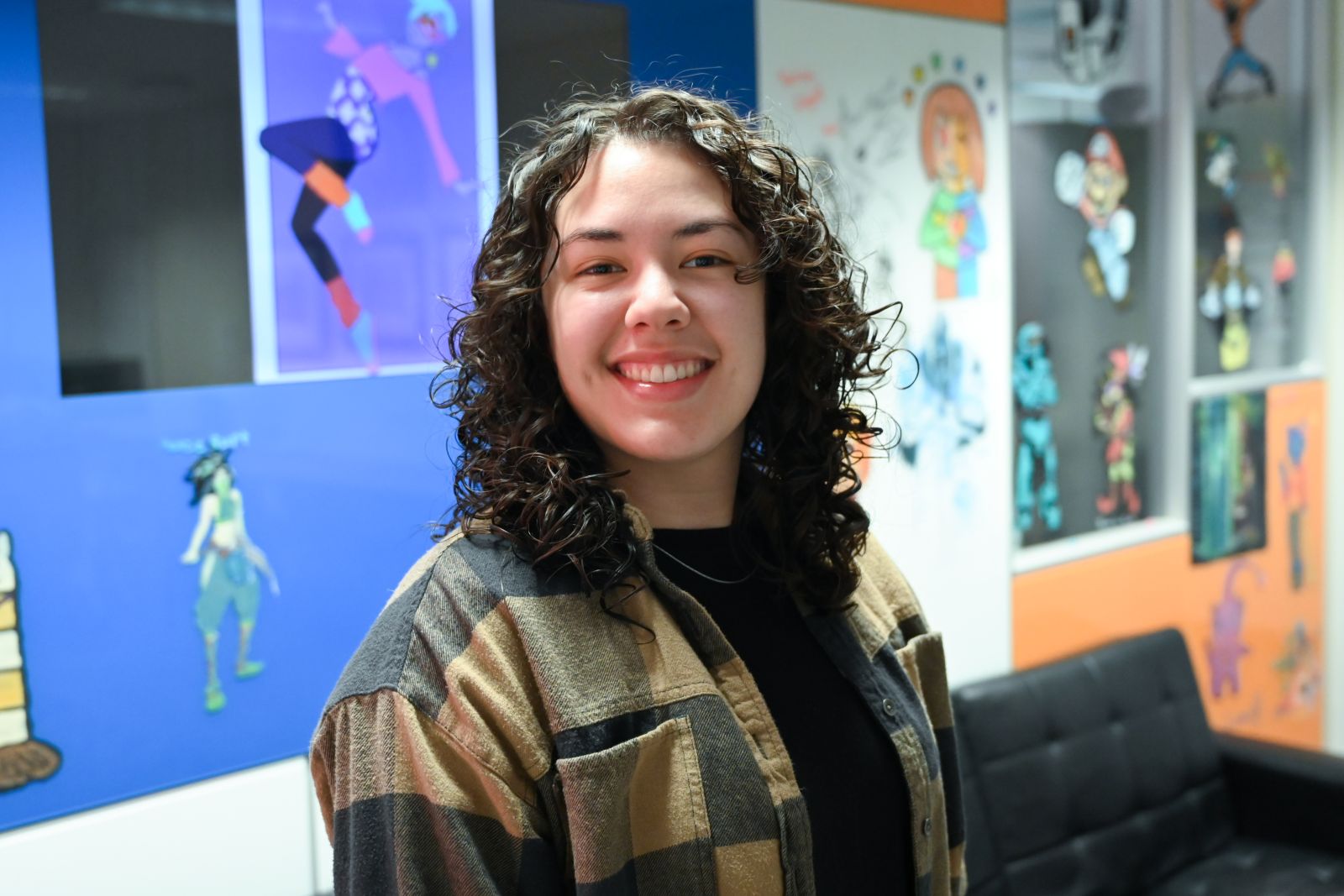 A portrait photo of Boise State student Kortny Serrano in the GIMM department office.