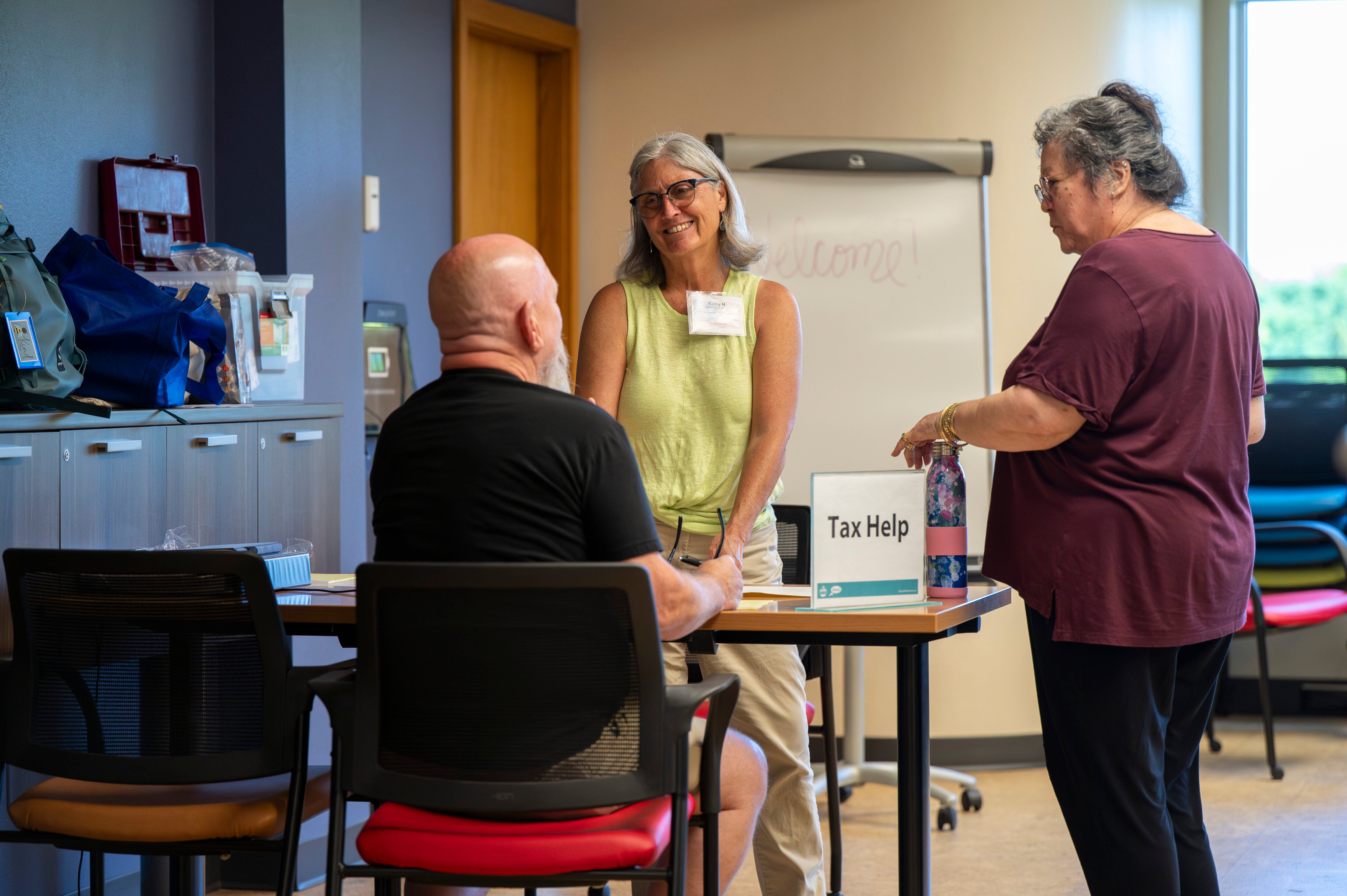 Kathy Hurley with a client and helper at Boise Public Library.