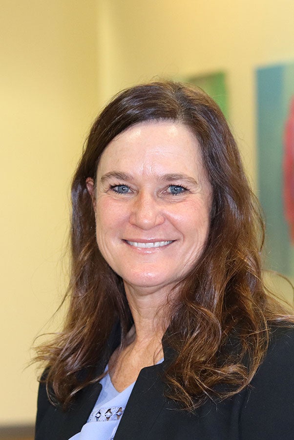 Headshot of April Howell smiling.