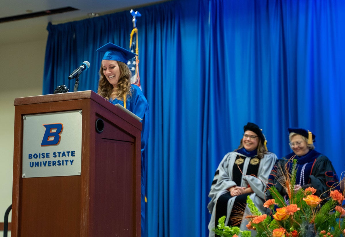 Amanda Timoney gives address from behind a podium.
