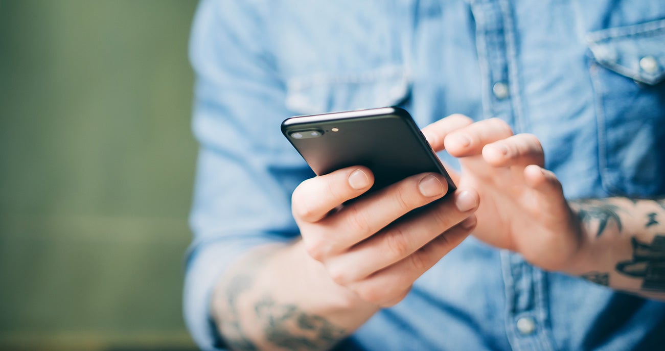 close up of man using cell phone