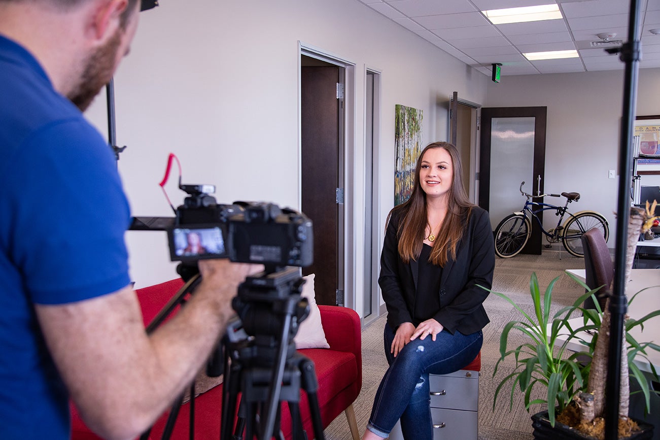 Sophia Hartsock sits in front of a camera at Red Sky.