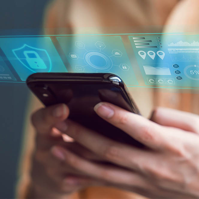 A photo illustration of a person working on a cybersecurity project on their phone