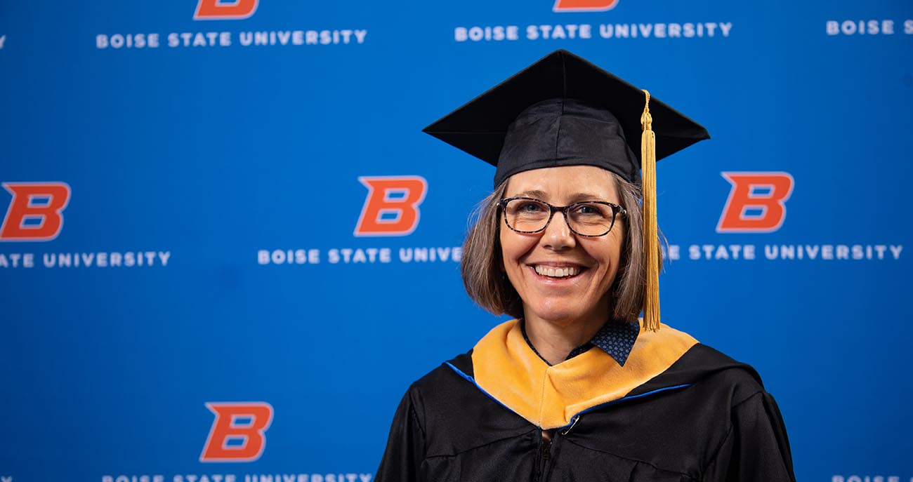 Woman posing for a graduation photo