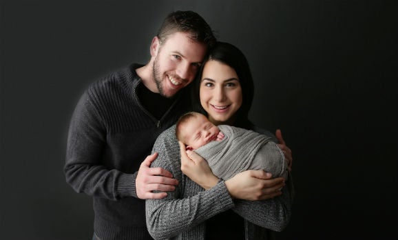Morgan Prince with her husband and child