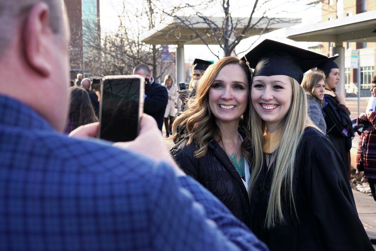 Master of Social Work graduates poses for a photo celebrating their graduation in December 2021.