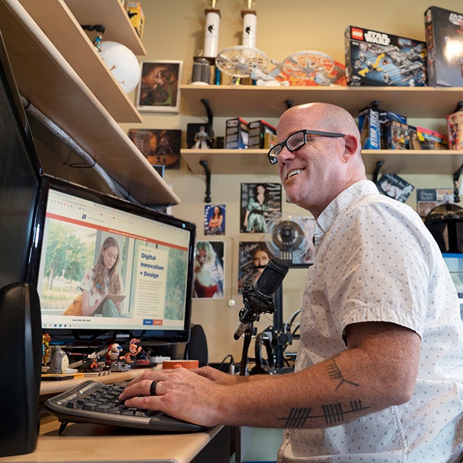 Program student sitting at his desk