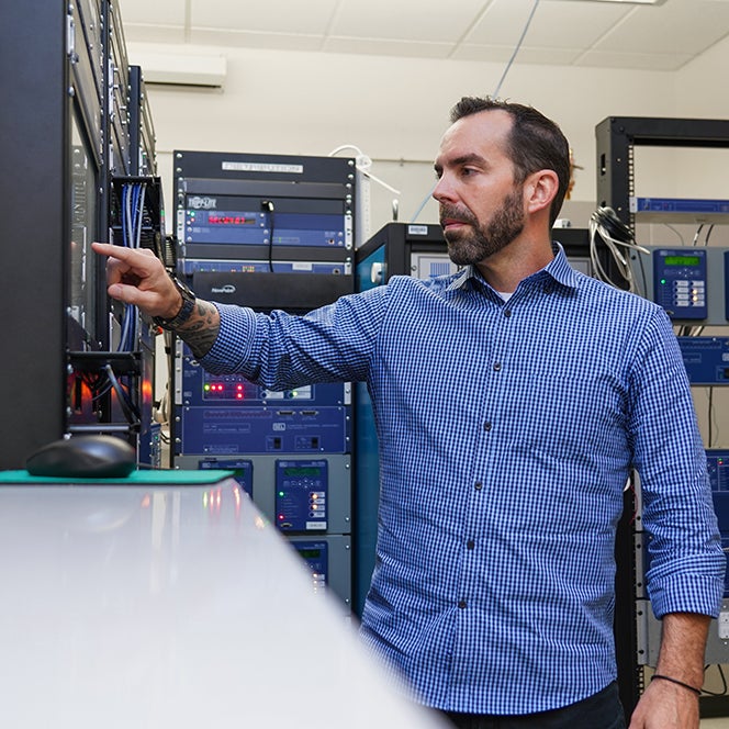 Cody Shepherd, gCORe student, working with a server