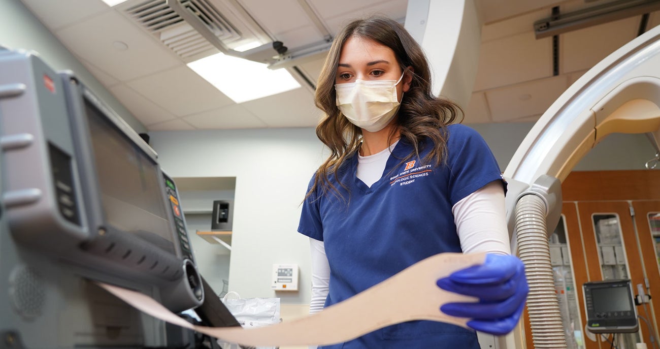 Advanced medical imaging student looks at imaging equipment