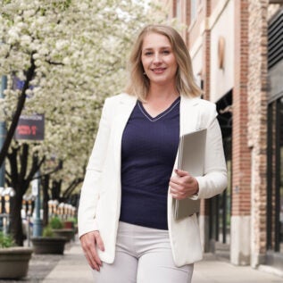 Business woman holding laptop