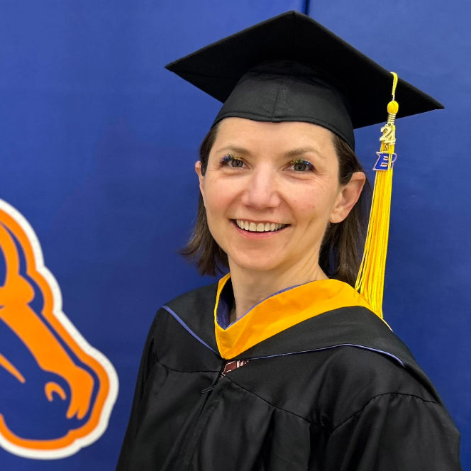 Portrait of Kelly Shrike in graduation cap and gown