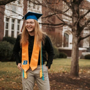 Aaron Lauritzen in graduation regalia