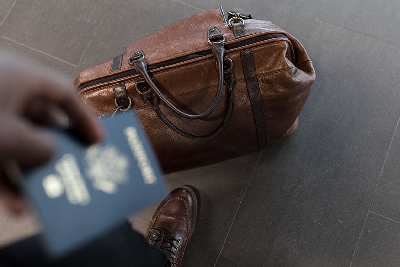 photo of suitcase and passport