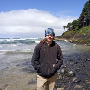 Seamus Mulhern standing in front of ocean